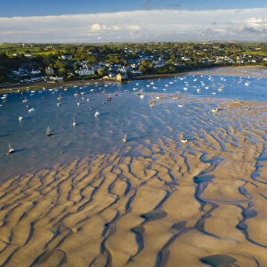 Aerial view of the Camel Estuary at low tide and the village of Rock, Cornwall, England