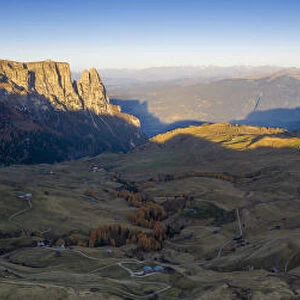 Aerial view by drone of autumn sunrise over Alpe di Siusi (Seiser Alm), Dolomites