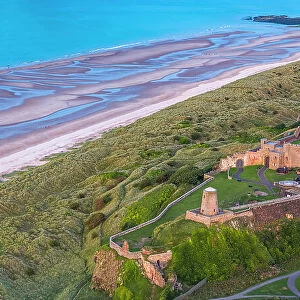 Aerial view by drone of Bamburgh Castle, Bamburgh, Northumberland, England, United Kingdom, Europe