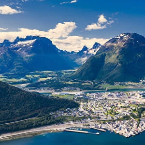 Aerial view by drone of mountains and fjord surrounding Andalsnes town, Rauma municipality
