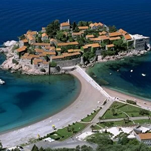 Aerial view over the island and beaches, Sveti Stefan, The Budva Riviera, Montenegro, Europe