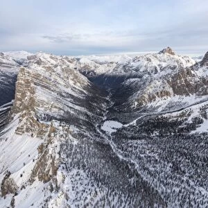 Aerial view of rocky peaks of Val Padeon and snowy woods, Cortina d Ampezzo, Province of Belluno