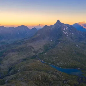 Aerial view of the sky at sunrise over the rocky peaks at Gavia Pass, Valfurva, Valtellina