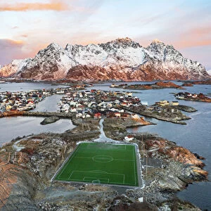 Aerial view of soccer stadium and Henningsvaer village during winter dawn, Nordland county, Lofoten Islands, Norway, Scandinavia, Europe