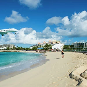 Airplane flying in the Princess Juliana International Airport of Maho Bay, Sint Maarten