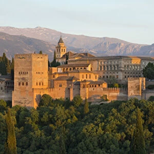 The Alhambra, UNESCO World Heritage Site, and Sierra Nevada mountains in evening