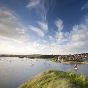 Alnmouth village and the Aln Estuary viewed from Church Hill on a calm late summers evening with a dramatic sky overhead, Alnmouth near Alnwick, Northumberland, England, United
