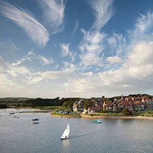 Alnmouth village and the Aln Estuary viewed from Church Hill on a calm late summers evening with a dramatic sky overhead, Alnmouth, near Alnwick, Northumberland, England, United