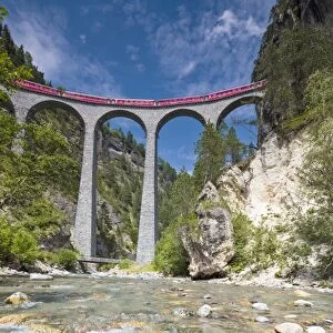 Alpine stream below the Bernina Express train on Landwasser Viadukt, Filisur, Albula Valley