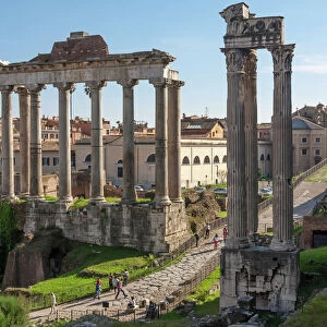 Ancient Roman Road traverses the columns and ruins in the Forum of Ancient Rome