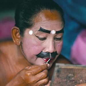 Applying make-up for the Barong classical dance