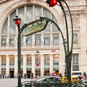 The art nouveau entrance to Gare du Nord metro station with the main railway station behind, Paris, France, Europe