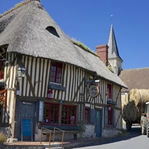 Auberge des Deux Tonneaux (Two Barrels Inn), typical ancient Norman cottage, thatched and half timbered, with tractor, Pierrefitte en Auge, Calvados, Normandy, France, Europe
