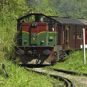 The Badulla to Colombo train, a scenic ride through the Central Highlands with its mountains