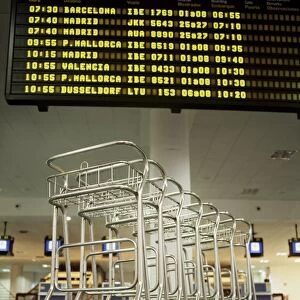 Baggage trolleys in departures area, Ibiza Airport, Spain, Europe