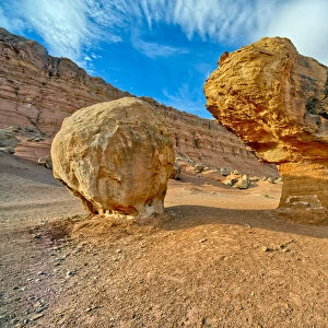 Balanced boulders at the base of Vermilion Cliffs in Glen Canyon Recreation Area, Arizona