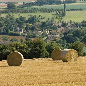 Bales of hay with Chipping Campden beyond, from the Cotswolds Way footpath