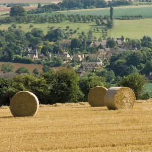 Bales of hay with Chipping Campden beyond, from the Cotswolds Way footpath