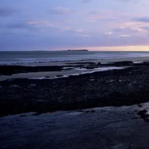 Bamburgh castle at sunrise, Bamburgh, Northumberland, England, United Kingdom, Europe