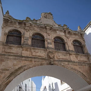A Baroque style arch in the Centro Storico of the medieval city of Ostuni, Puglia, Italy