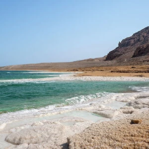 Beach with salt crystalized formation and turquoise water, The Dead Sea, Jordan, Middle East