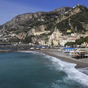 Beach, town and hills of Amalfi in sunshine with breaking waves, Costiera Amalfitana (Amalfi Coast)