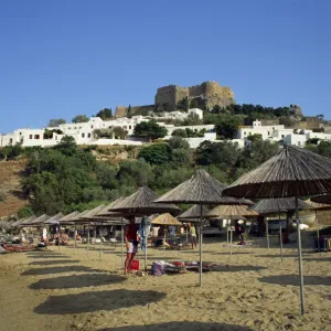 The beach below the white houses and acropolis of Lindos Town