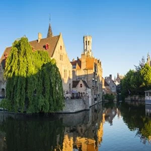 Belfort van Brugge and medieval buildings on the Dijver canal from Rozenhoedkaai at dawn