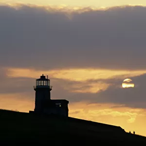 Belle Tout lighthouse on cliffs at sunset, near Birling Gap, East Sussex, England, United Kingdom, Europe