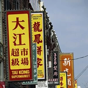 Bi-lingual Chinese and English signs on Spadina Avenue in Chinatown in downtown Toronto