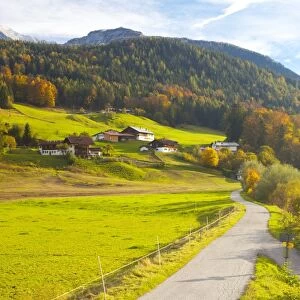 Bicycle path through rural mountain landscape in autumn, near Berchtesgaden, Bavaria, Germany, Europe