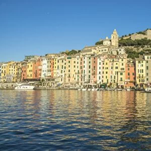 The blue sea frames the typical colored houses of Portovenere, UNESCO World Heritage Site