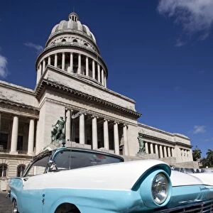 Blue vintage American car parked opposite The Capitolio, Havana Centro, Havana, Cuba, West Indies, Central America