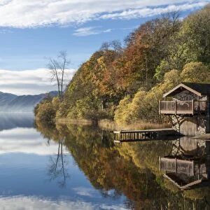 Boathouse and reflections, Lake Ullswater, Lake District National Park, Cumbria, England