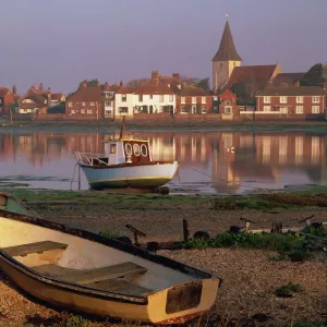 Boats in Bosham from across the tidal creek in early morning, on one of the small inlets of Chichester Harbour, Bosham, West Sussex, England, United