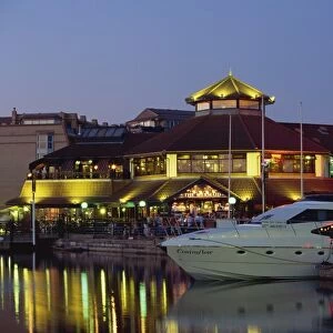 Boats and restaurants at dusk, Marina, Port Solent, Hampshire, England