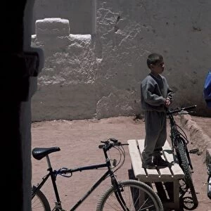 Boy and bike, San Pedro de Atacama, Chile, South America