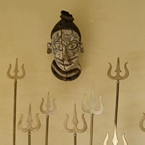 Brass reproductions of Lord Shivas trident as a decorative feature