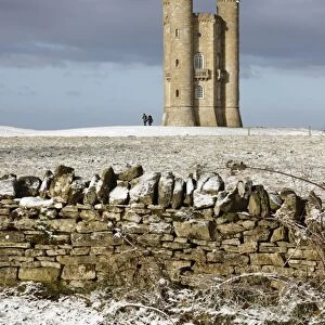 Broadway Tower and Cotswold drystone wall in snow, Broadway, Cotswolds, Worcestershire
