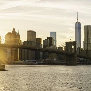 Brooklyn Bridge and Lower Manhattan skyline at sunset, New York City, New York, United States of America, North America