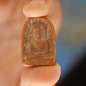 Buddhist amulet, Paris, France, Europe