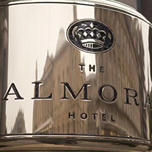 Buildings reflected in the Balmoral Hotels name plate, Princes Street