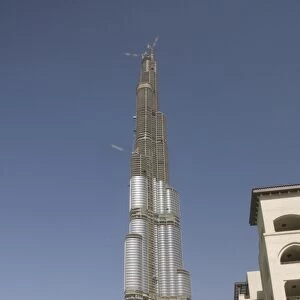 Burj Dubai, worlds tallest building, under construction, overlooking the new Mazaya shopping centre, Dubai Creek, Dubai, United Arab Emirates