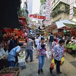 A busy market in Chinatown, a slice of old Hong Kong in Central, the business centre of Hong Kong Island