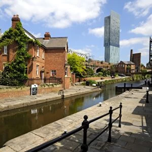 Canal and lock keepers cottage at Castlefield with the Beetham Tower in the background