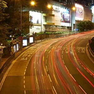 Car light trails on a busy road in Central, Hong Kong Island by night, Hong Kong