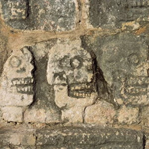 Carvings of skulls on the Tzompantli