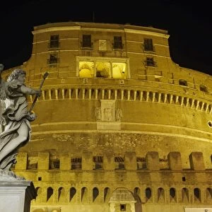 Castel Sant Angelo facade at night with statue on Ponte Sant Angelo, UNESCO World Heritage Site