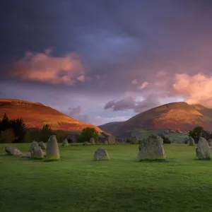 Castlerigg Stone Circle in autumn at sunrise with Blencathra bathed in dramatic dawn light