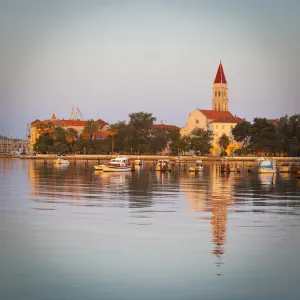 Cathedral of St. Lawrence illuminated at sunrise, Stari Grad (Old Town), Trogir, Dalmatia, Croatia, Europe